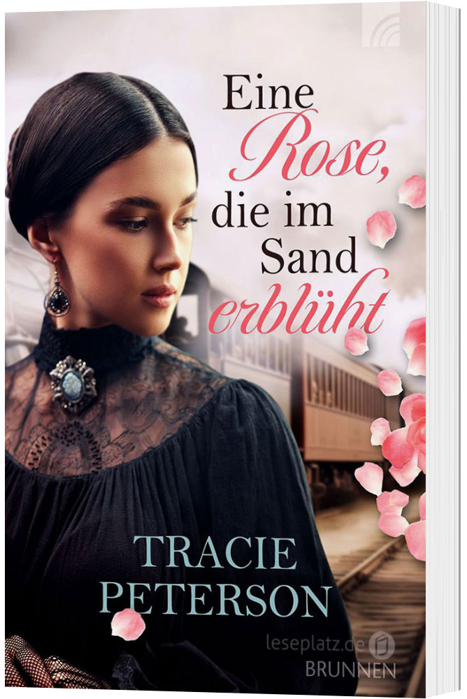 Eine Rose, die im Sand erblüht